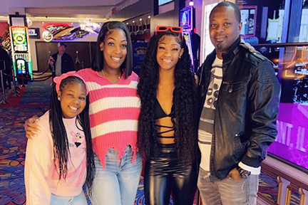 Michaelah surrounded by her loving family.