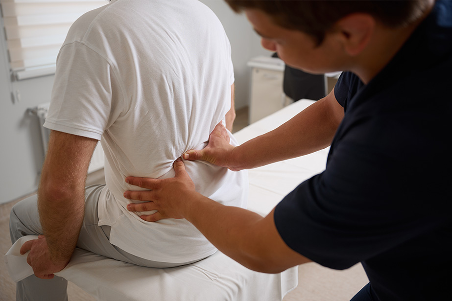 Woman with back pain looking uncomfortable