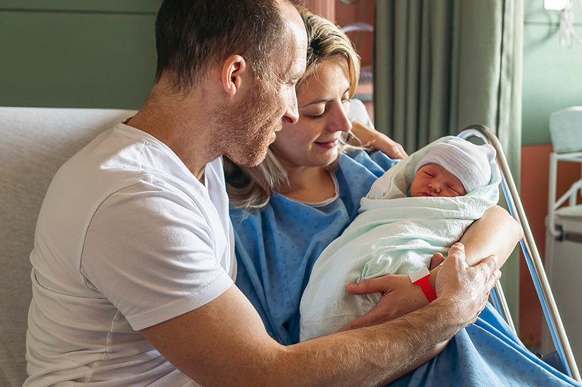A couple with their newborn